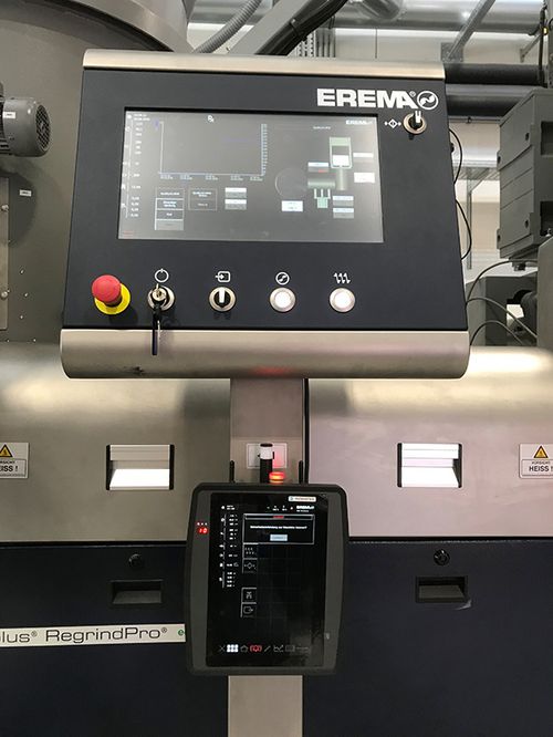 The central control panel of the EREMA machine and below the wireless handheld control unit from SIGMATEK